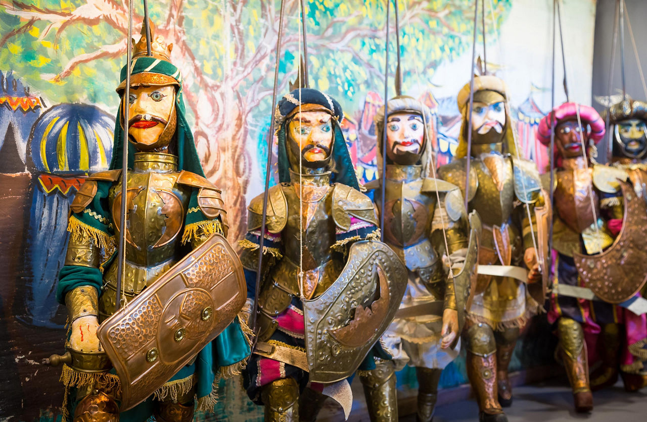 Various sicilian puppets at a market