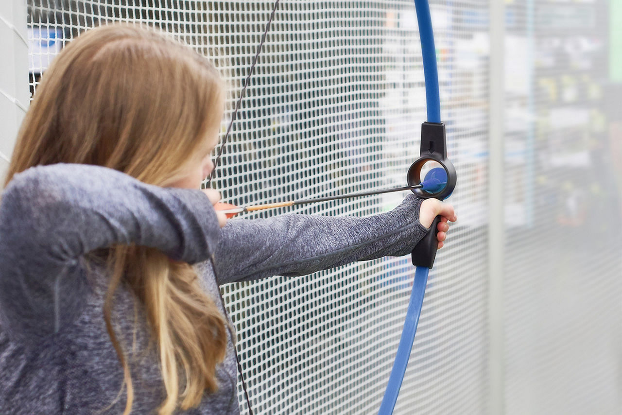 Woman Focusing on Archery