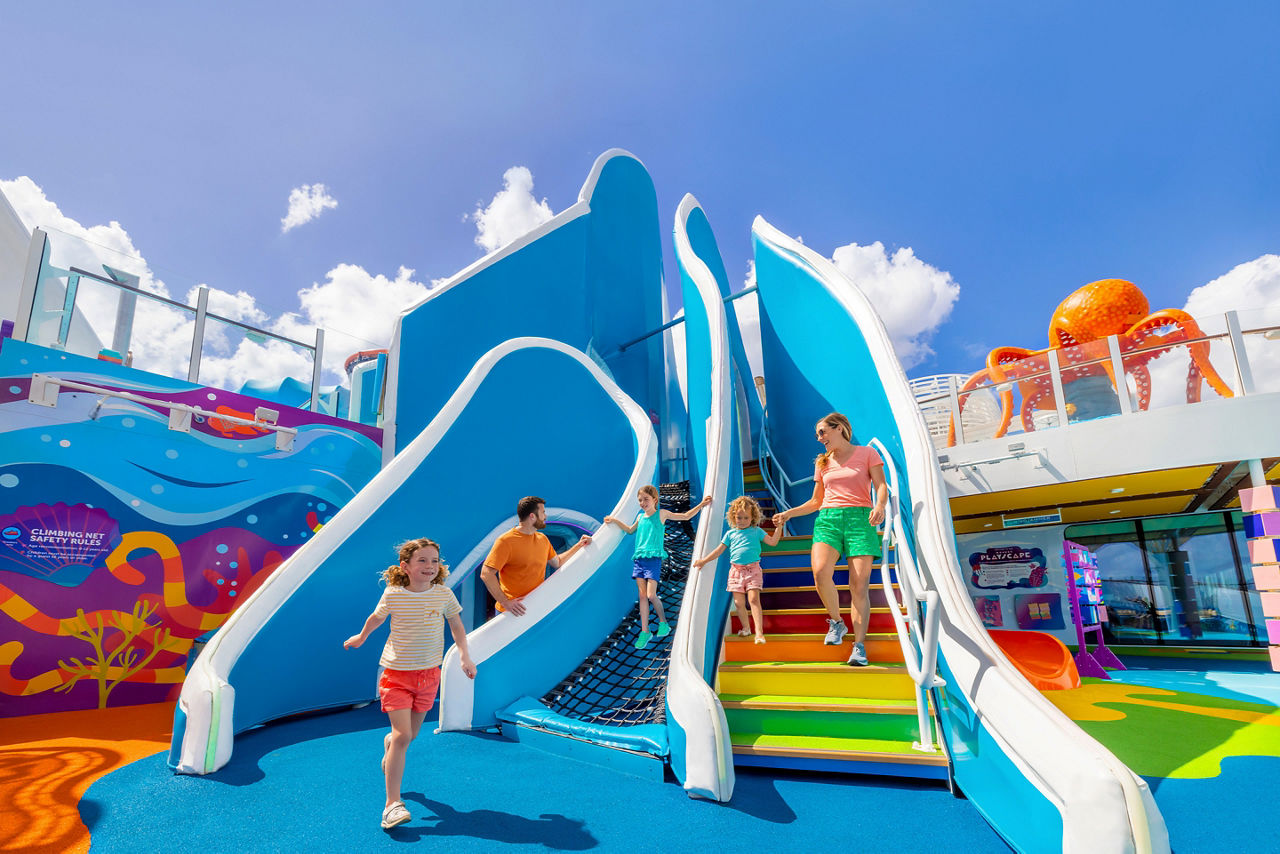 WN, Wonder of the Seas, family fun at Playscape, daytime, mother and daughter on stairs, one child running, dad watching daughter on ropes, blue colors, octopus statue in right background,