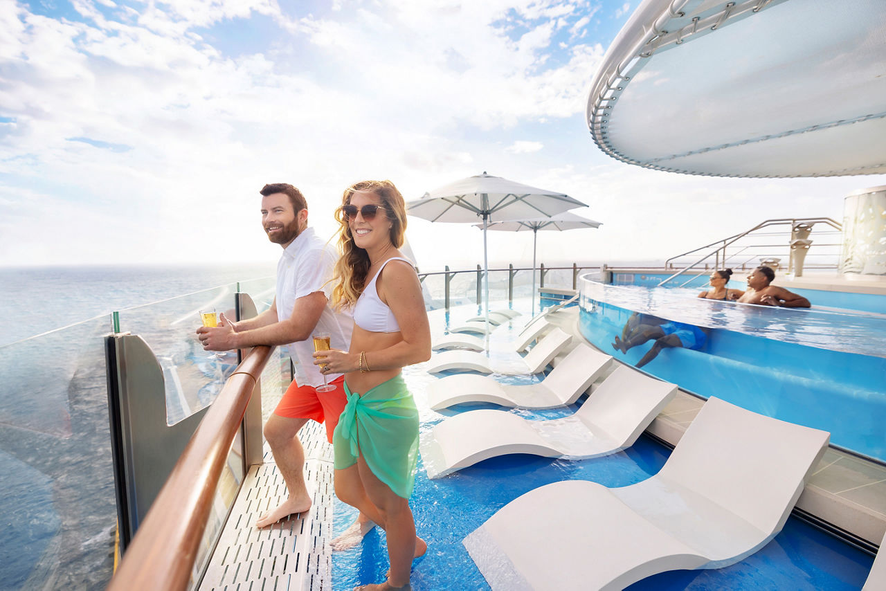 Couple Enjoying the View at the Infinity Pool 