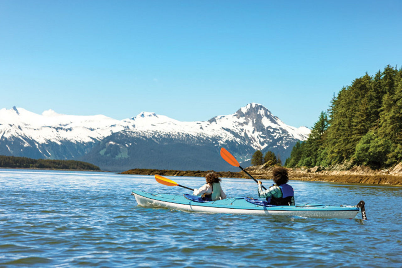 Couple Kayaking by Glaciers, Juneau, Alaska