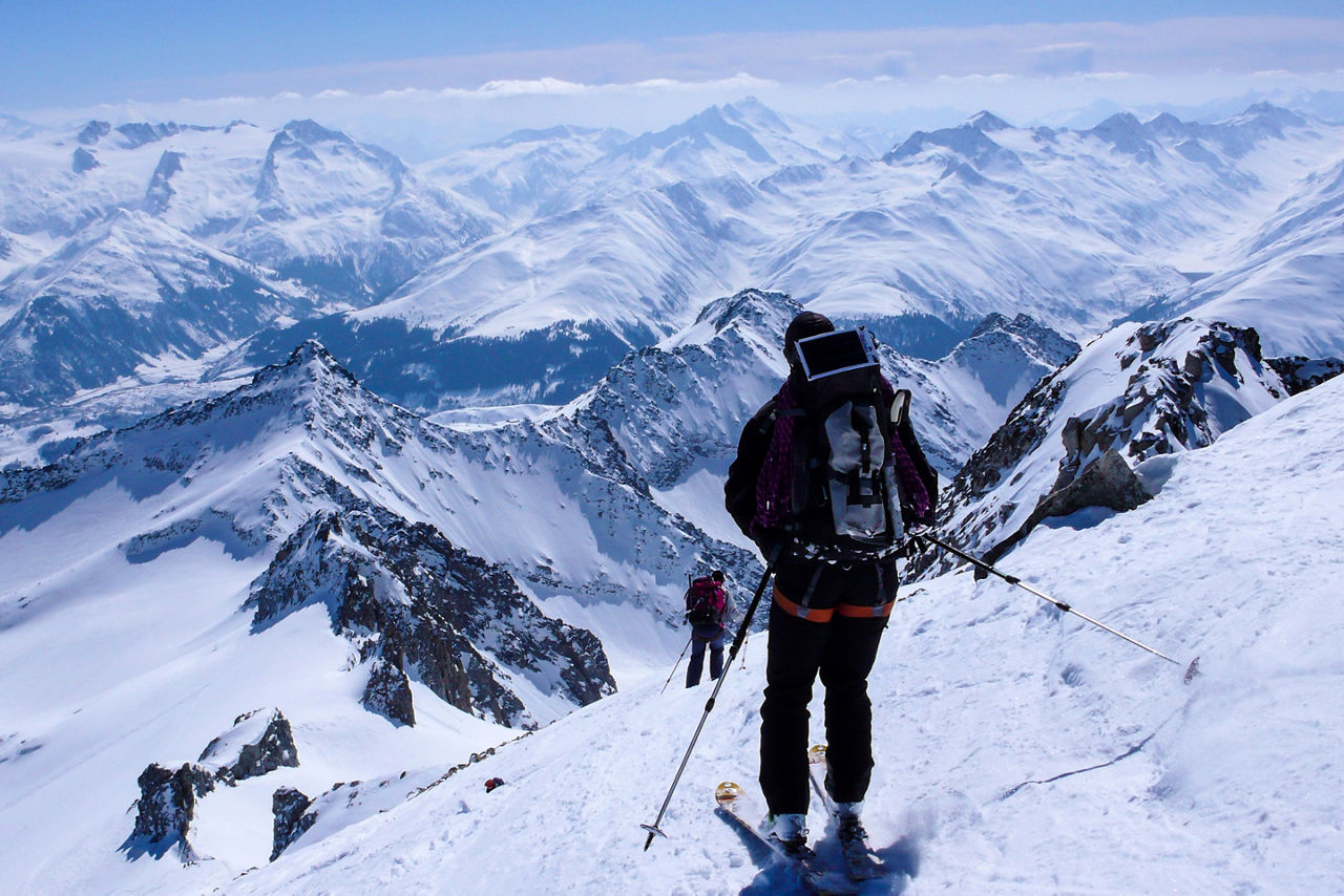 Male Backcountry Skier Skiing Down High French Swiss Alps