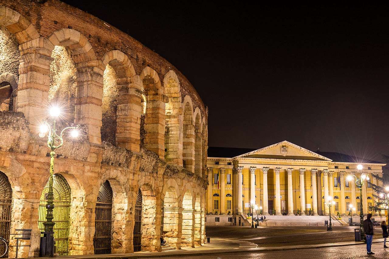 The Arena and Palazzo Barbieri at night in Verona. Italy.