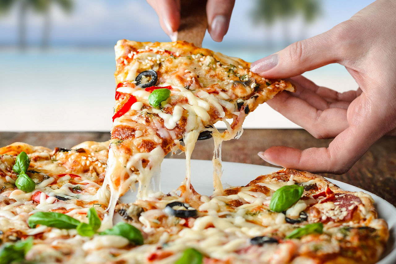 perfect day coco cay hideaway beach slice of paradise pizza close up