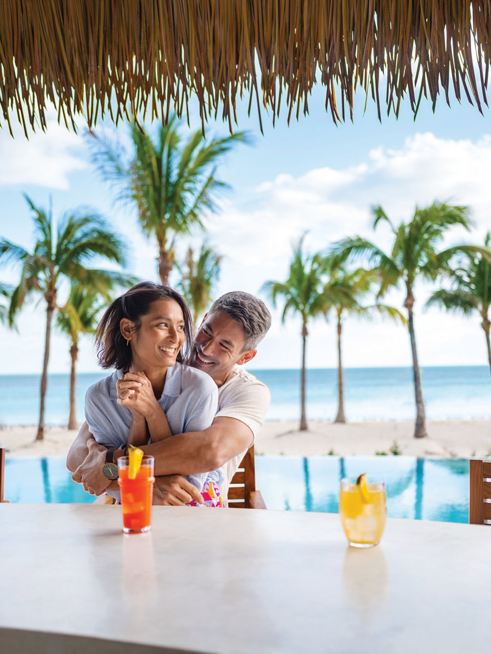 Coco Beach Club Couple Embracing by the Bar, Perfect Day at Coco Cay