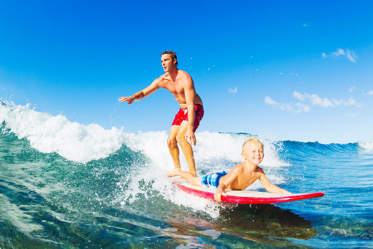 Dad and Son Surfing in the Caribbean 