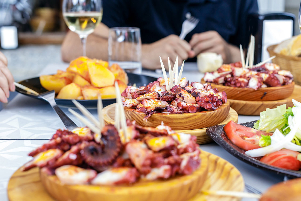 People Eating Pulpo a la Gallega