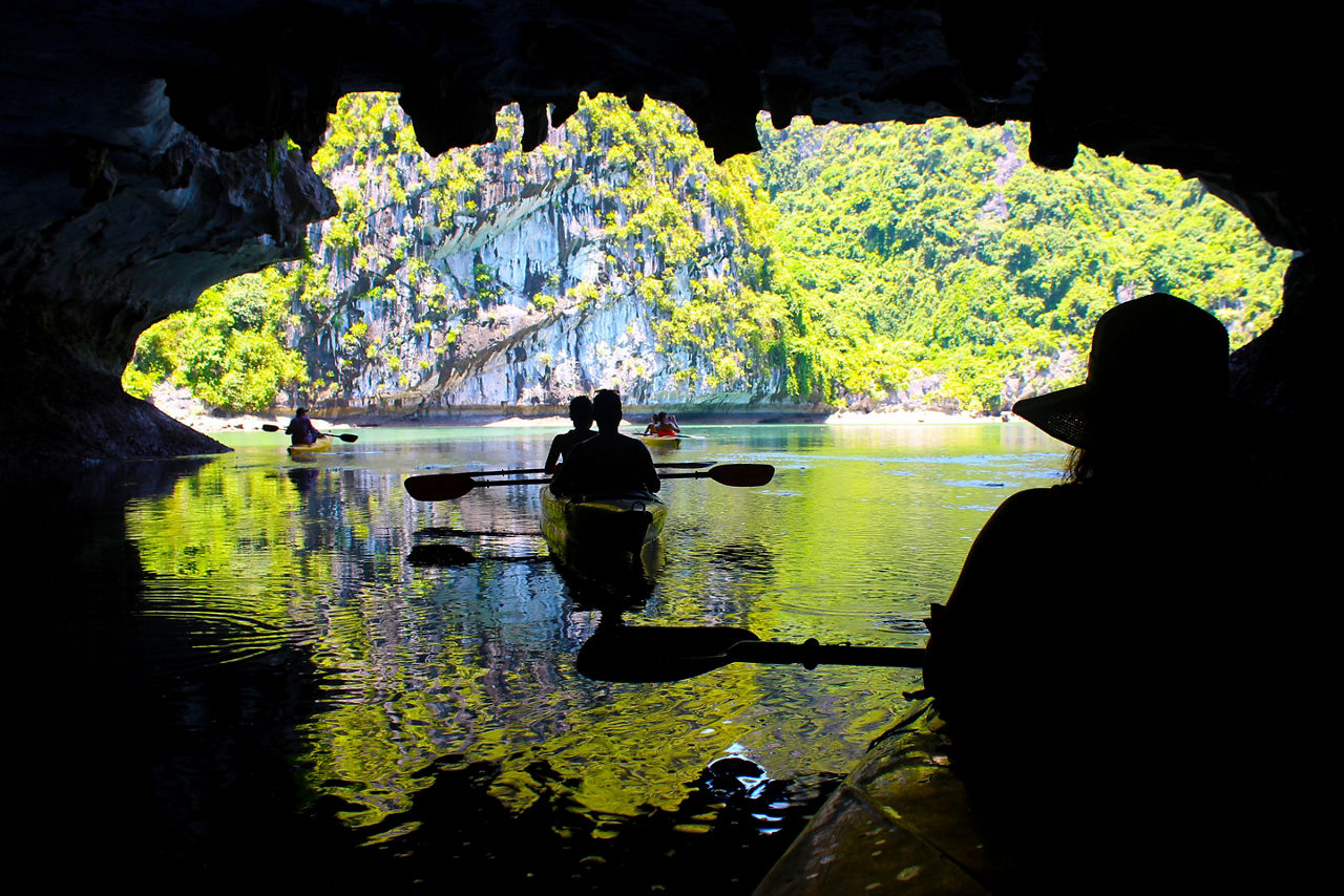 Silhouettes Couple Kayaking Inside a Cave