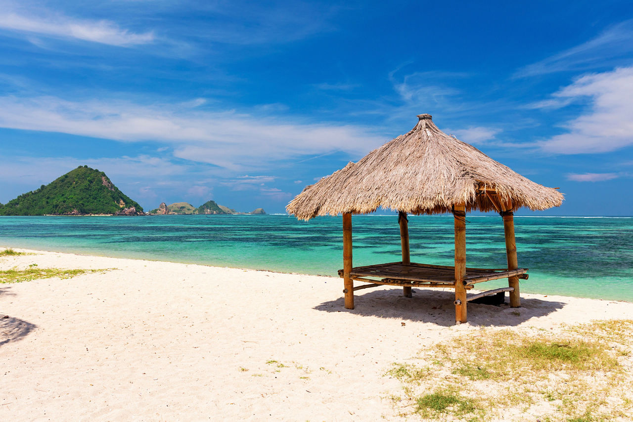 Balinese hut on the white sandy Kuta Beach, Lombok, Indoneasia