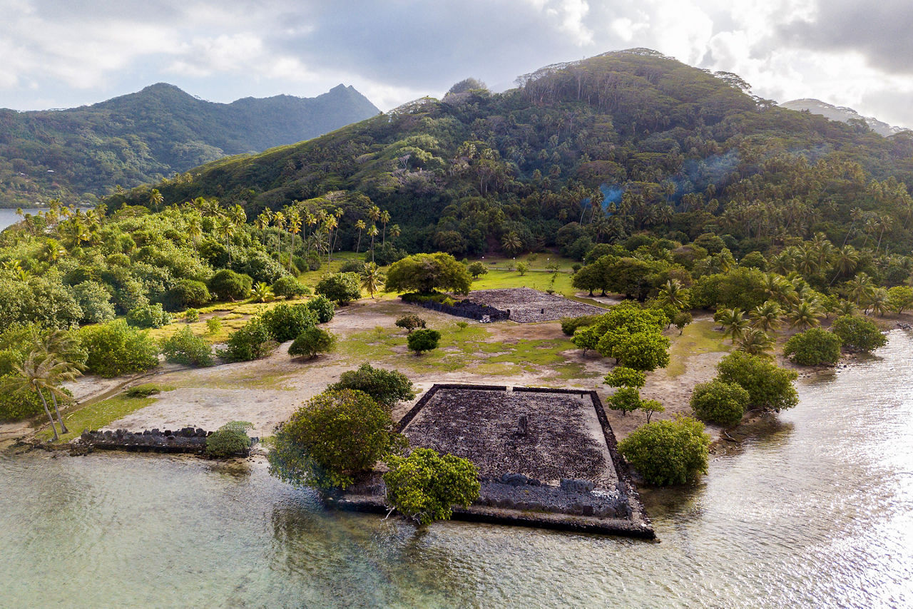 Ancient Marae Taputapuatea temple complex on the lagoon shore 