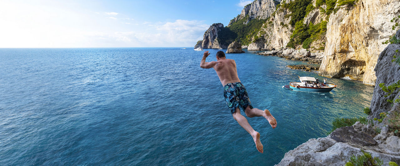 HP Man Jumping Cliff Naples Italy