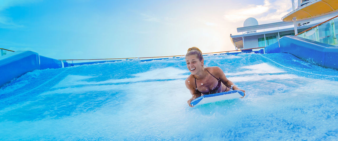 Girl in riding a bodyboard in Flowrider | HP