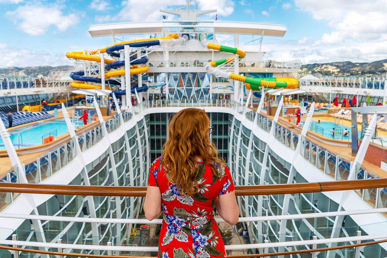 Girl Overlooking the Balcony on Symphony of the Seas 