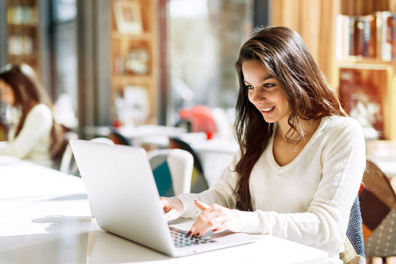 Woman Booking a Cruise Online