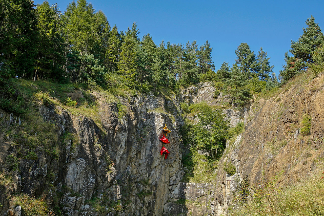 Colorful portaledge hanging tents for rock climbers