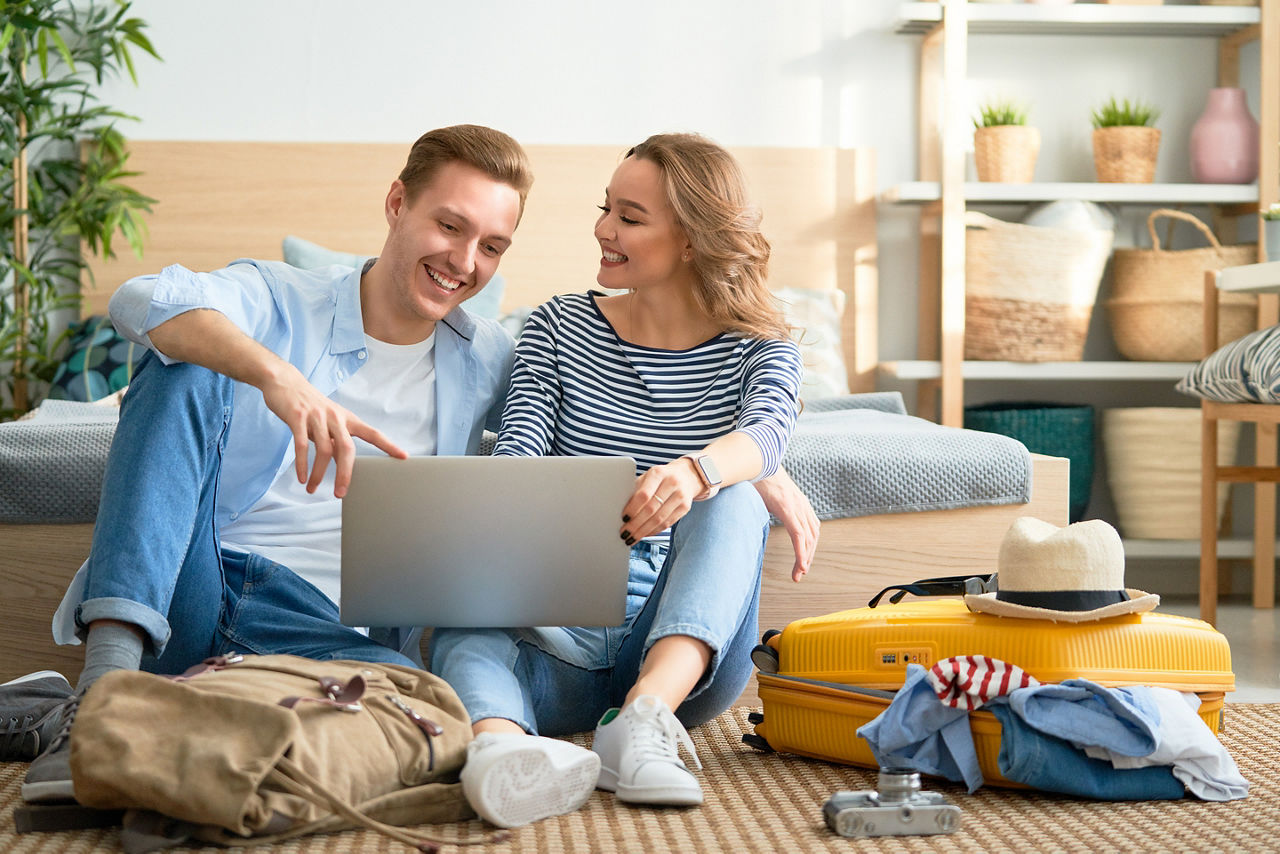 Couple searching for travel deals for Black Friday. America.