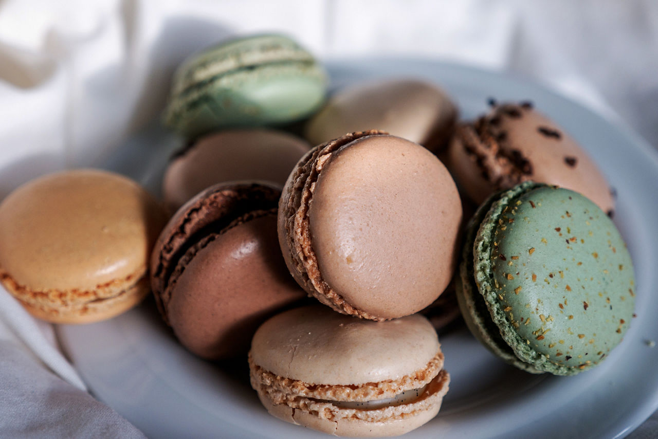 Enjoying macarons on vacation in Paris. France.