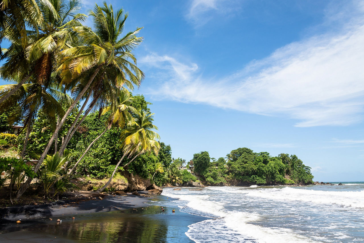 traveling to the volcanic black sanded beach of Bananier. The Caribbean.