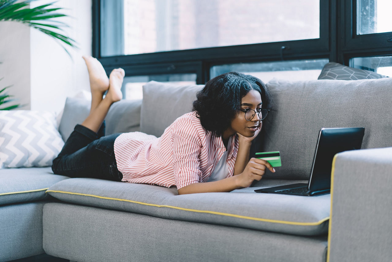 Woman searching to book a cruise for Black Friday deals. America