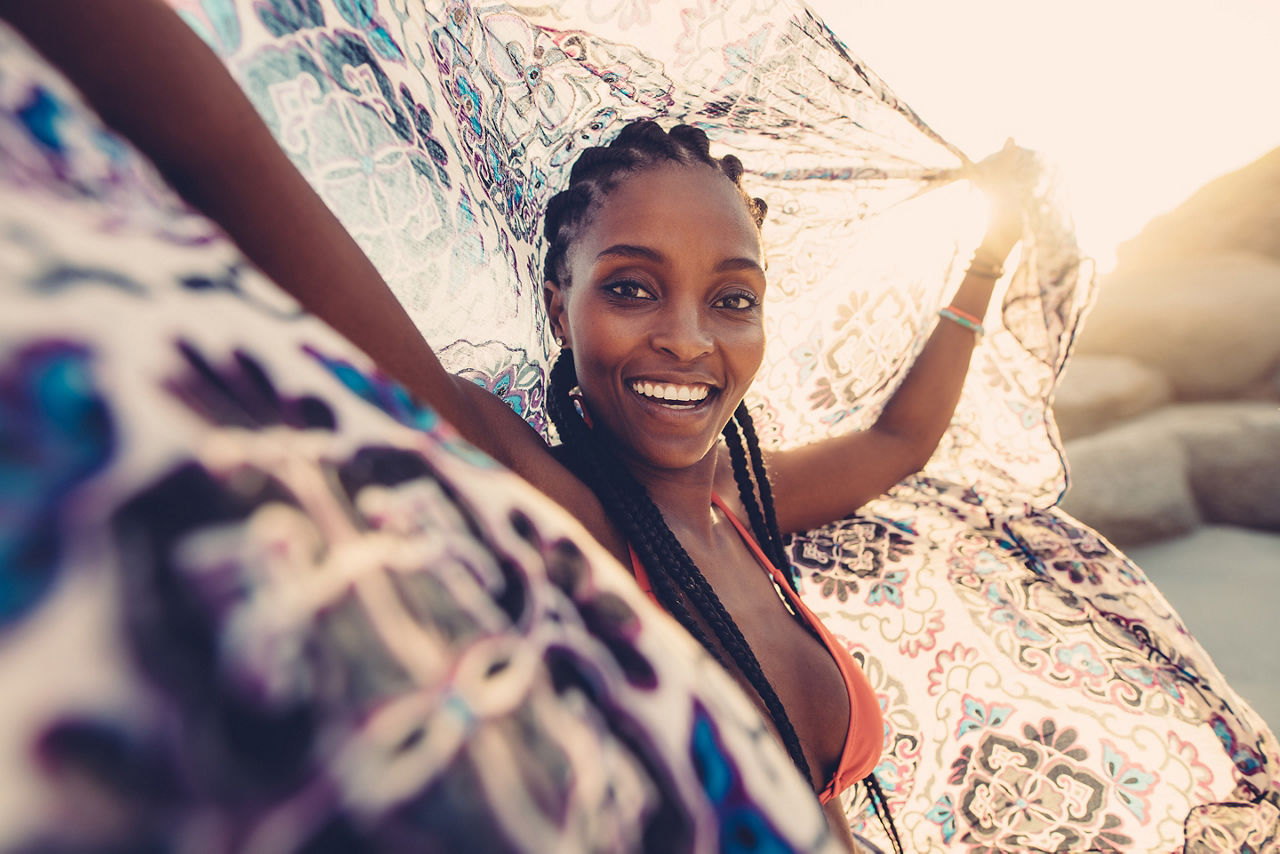 Woman smiling with joy in bathing suit. The Caribbean.