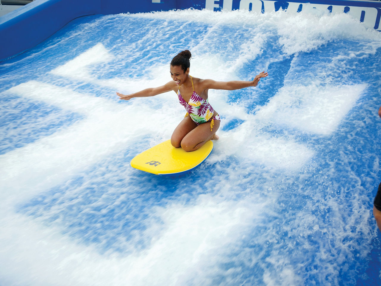 Young Woman Body Surfing Flowrider