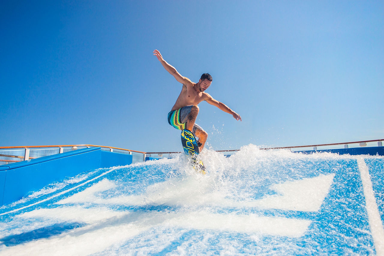 Man Jumping Mid Air on Flowrider 