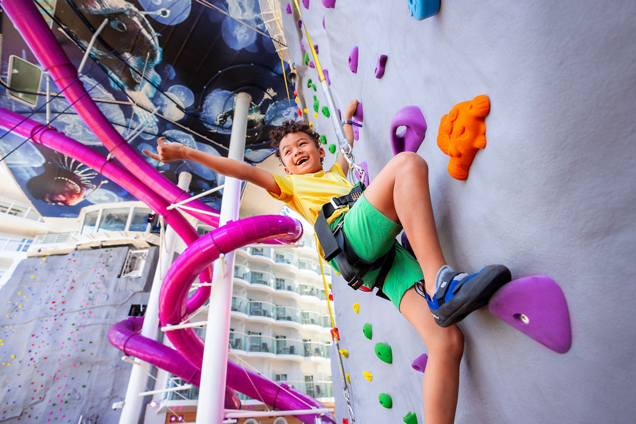 Rock Climbing Wall Boy Almost Reaching the Bell