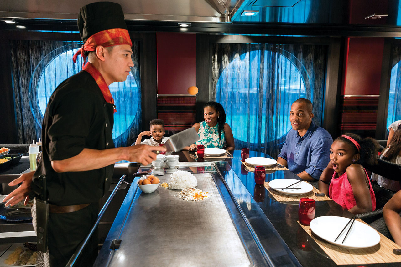 Family Enjoying a Hibachi Chef Cooking