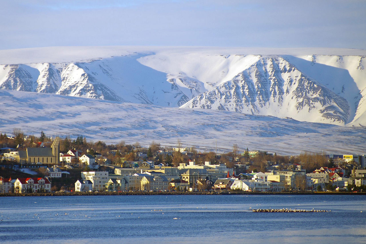 View of Akureyri, Iceland with ice covered mountains in the background