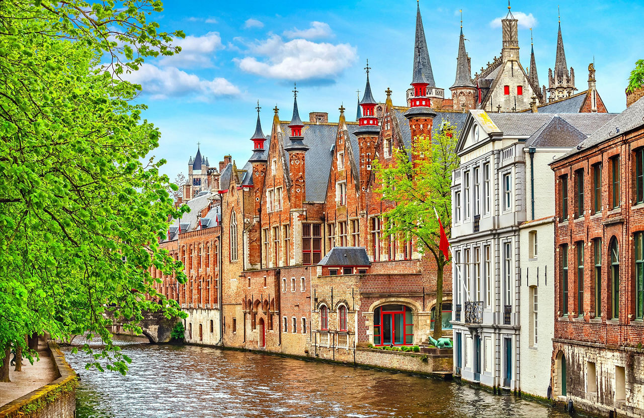 Old brick homes lining a canal in Bruges, Belgium