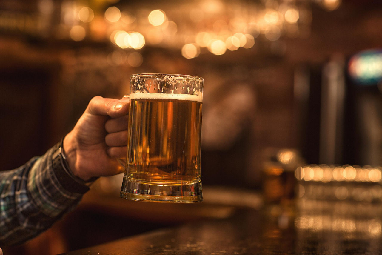 A man holding a beer mug