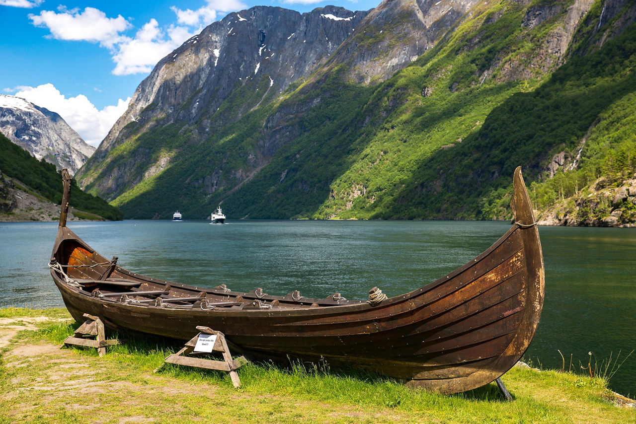 A Replica Viking Boat with Mountains in the Background, Flam, Norway 