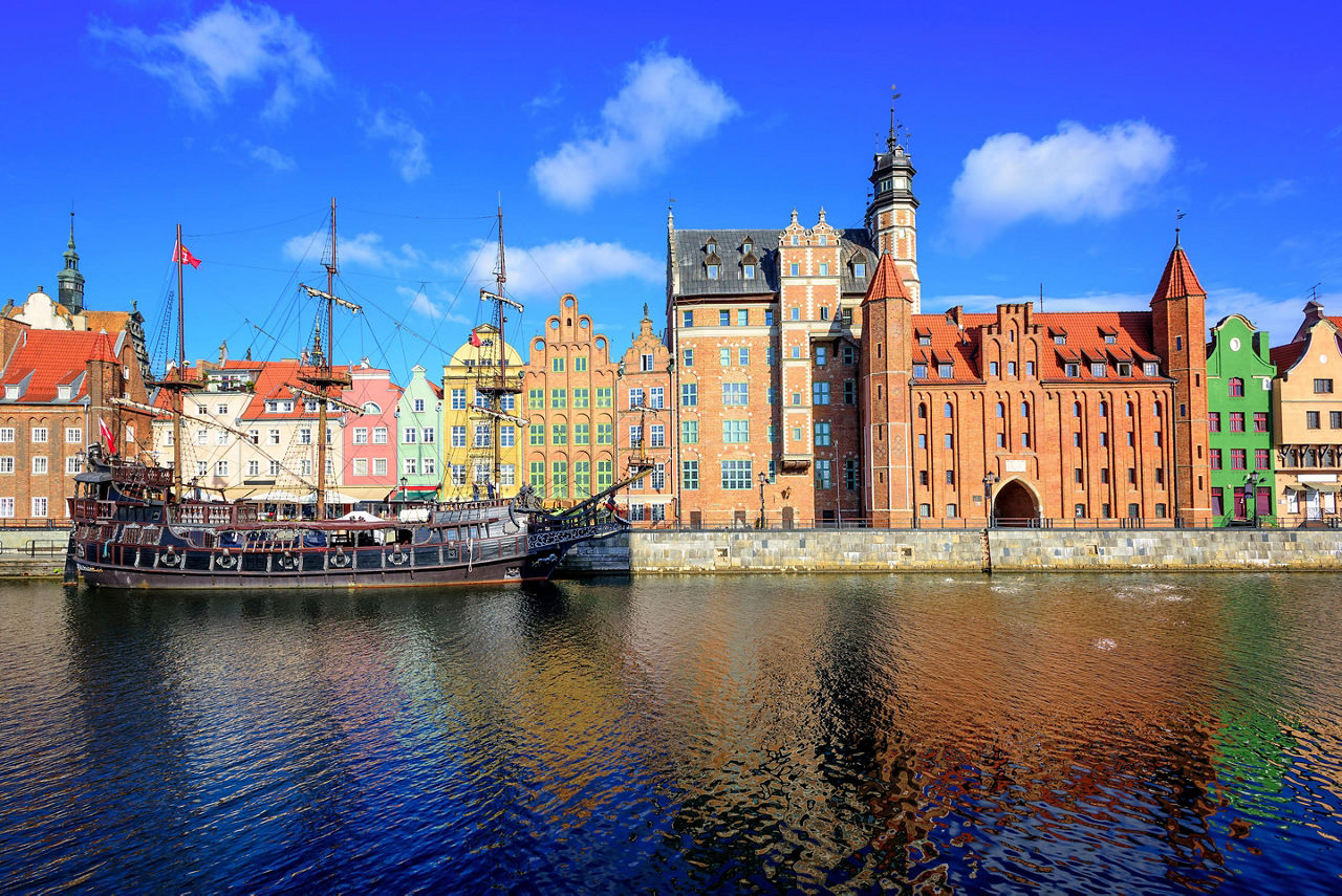 Coastal view of old town and a vintage ship in Gdansk, Poland