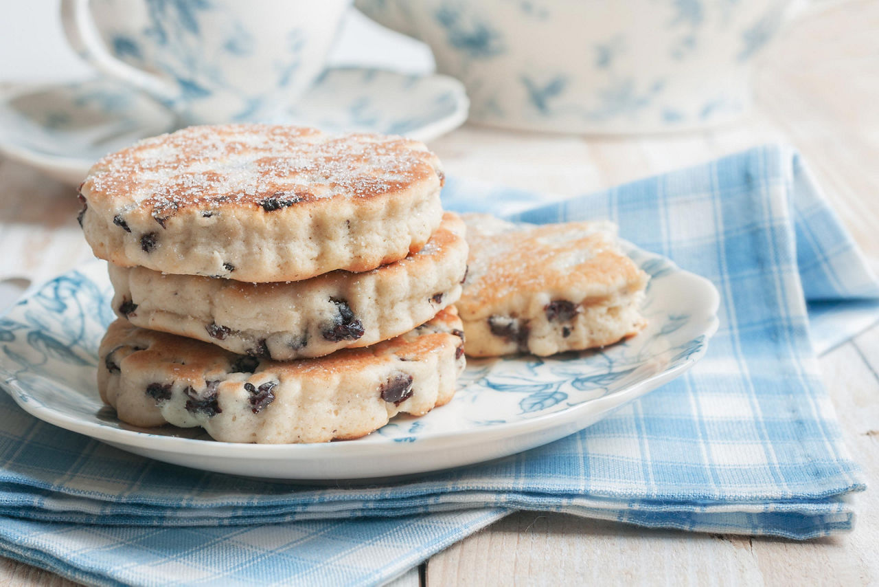 Four welsh griddle cakes on a blue and white plate