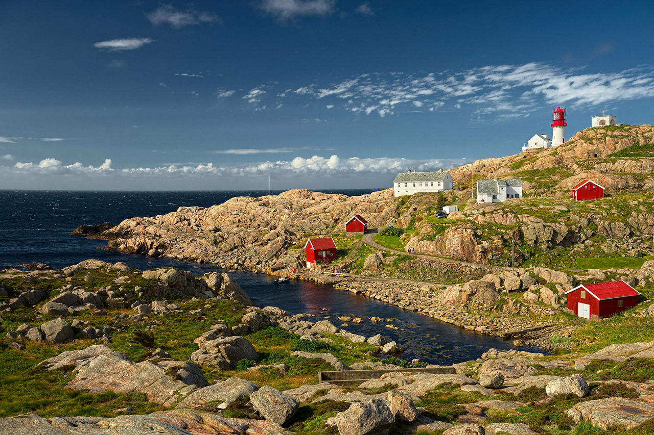 Coastal buildings and a lighthouse in Kristiansand, Norway