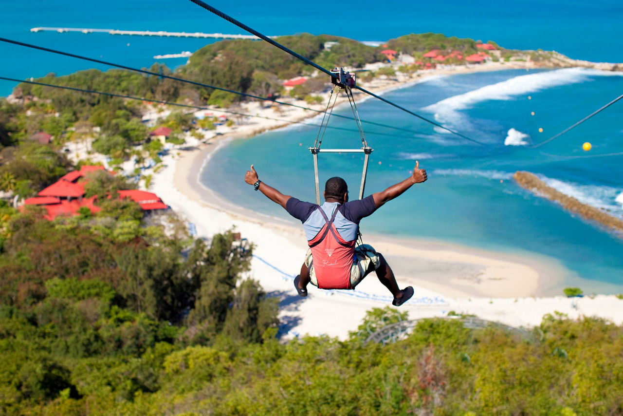 Man Zip Lining Down Dragon's Breath Flight Line, Labadee, Haiti