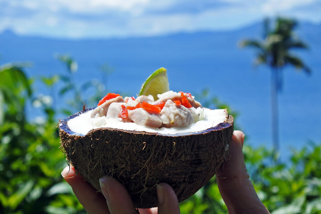 A coconut filled with Kokoda, a raw fish salad