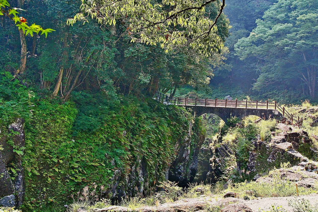 Takachiho Gorge, a narrow chasm cut through the rock by Gokase River with nearly sheer cliffs lining the gorge are made of slow forming volcanic basalt columns, Takachiho, Miyazaki, Kyushu, Japan