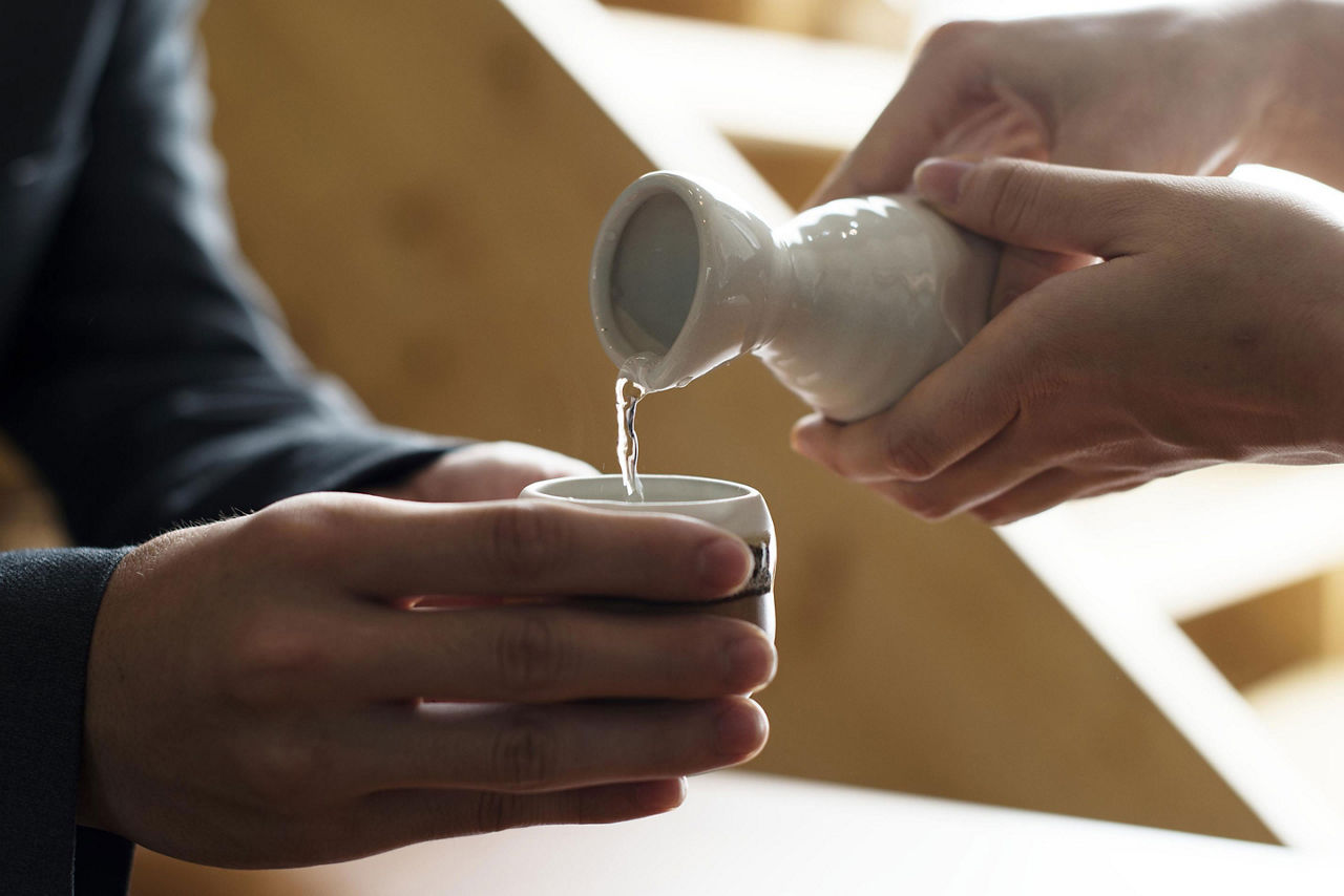 Sake being poured in a shop in Niigata, Japan