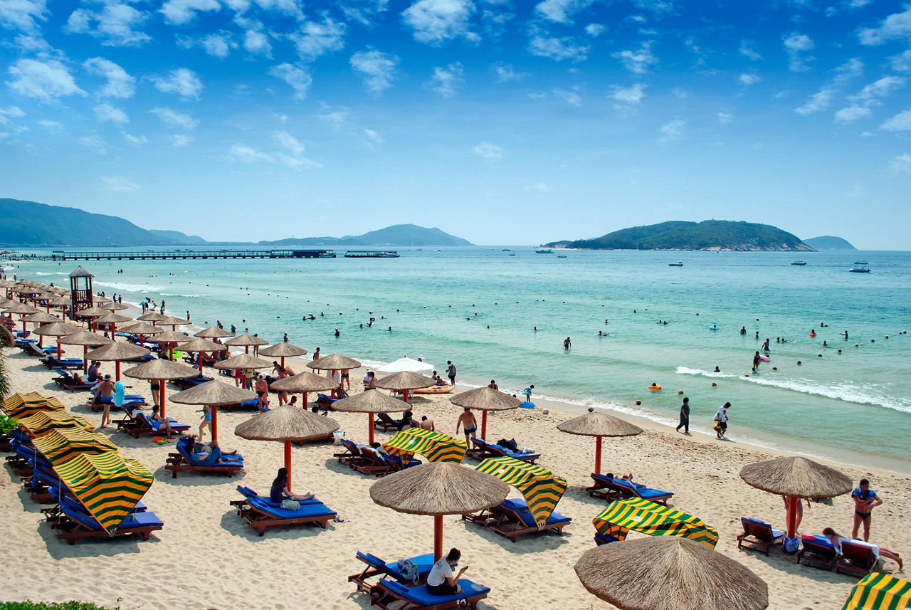 People enjoying a beach in Sanya, China