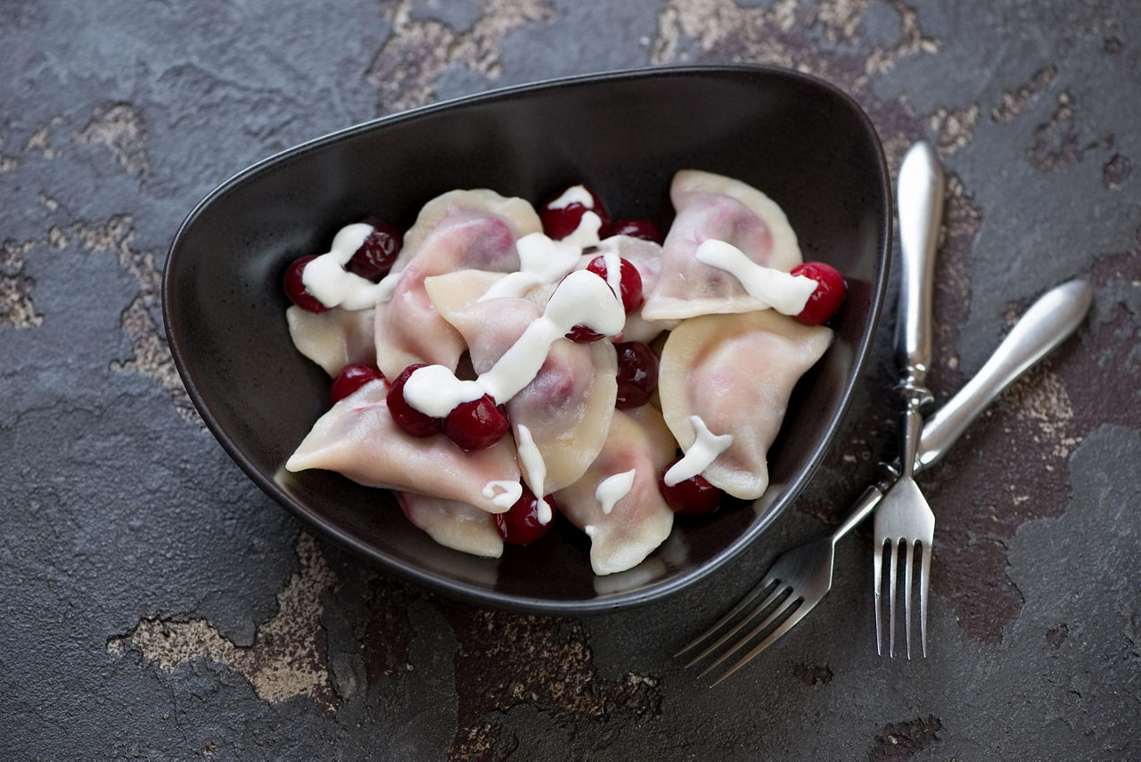 A bowl of boiled vareniki with cherry stuffing