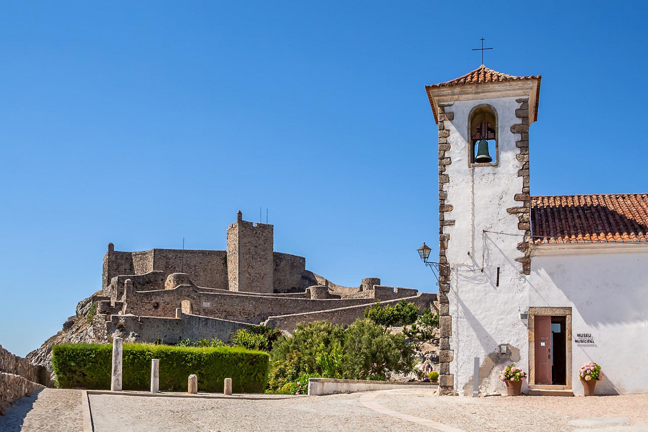 View of the Santa Maria church with the Marvao castle in the distance in Vigo, Spain