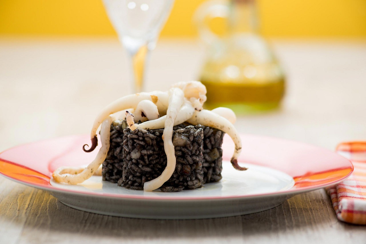 Cuttlefish risotto on a plate