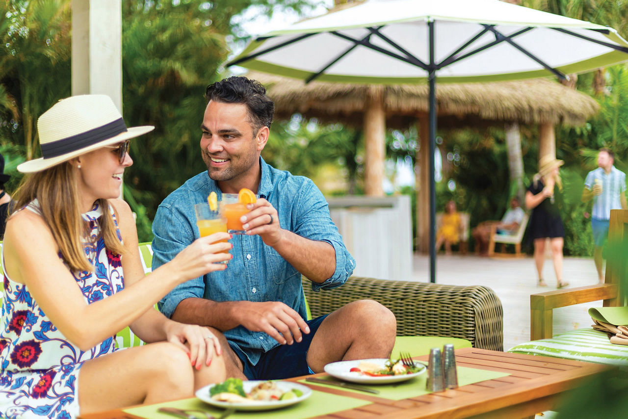 Coco Beach Club Restaurants Couple Celebrating, Perfect Day at Coco Cay